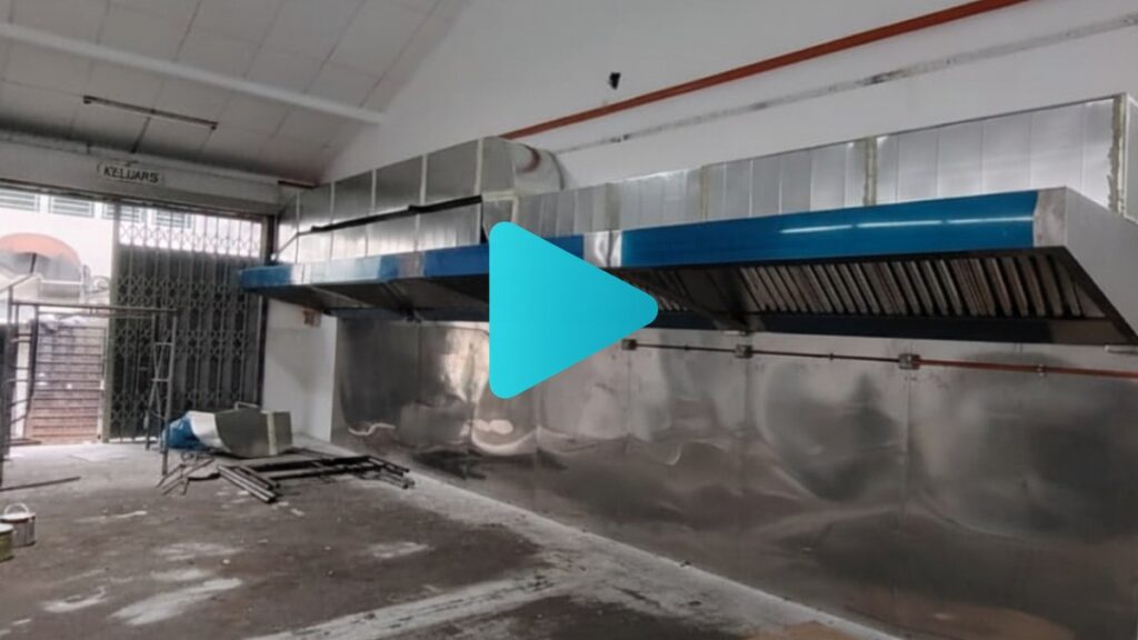 Stainless steel industrial exhaust hood and motor system installed in a food processing factory by CrystalAir.