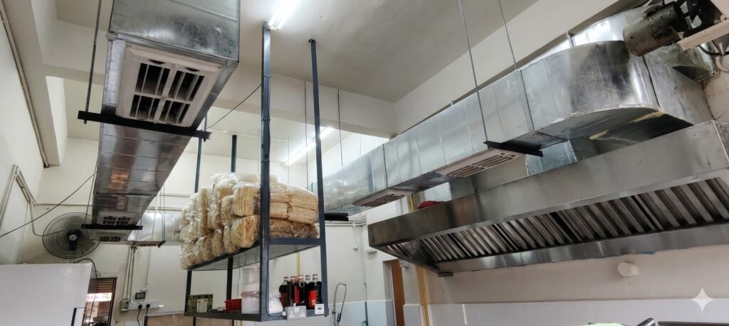 Custom 9ft stainless steel kitchen exhaust hood and ducting system installation by CrystalAir in KL.