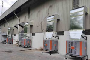 Four CrystalAir AC-500 evaporative air coolers installed outside an instant noodle factory production floor in Malaysia.