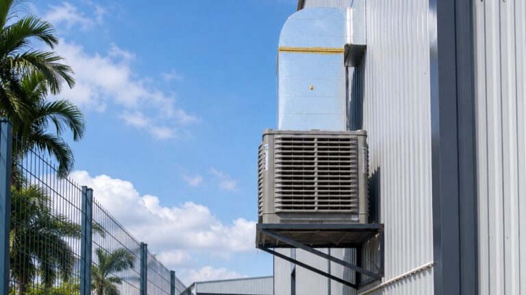 Industrial air cooler installed on the side wall of a modern factory building in Malaysia