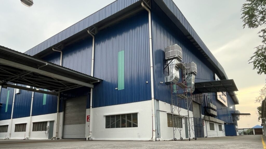 Side view of factory complete ventilation installation with CrystalAir AC-350 air coolers mounted on the exterior wall.