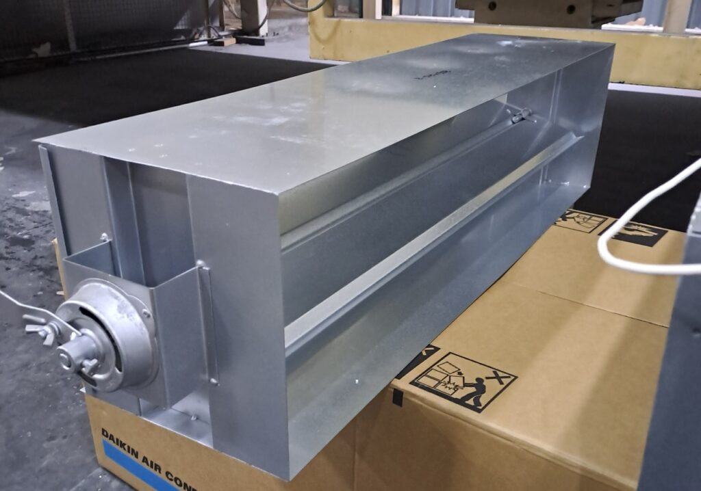 Individual airflow damper for a ducted air conditioner used in a dual-unit factory cooling system.