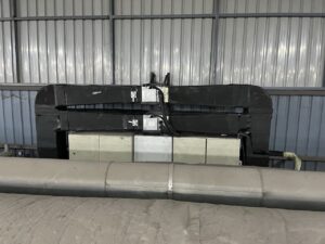 Two 1.5 HP ducted air conditioners installed for 24-hour factory machine control panel cooling.