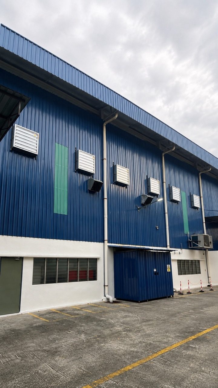 Six CrystalAir EX-325 box-type exhaust fans installed on the factory wall for hot air extraction.