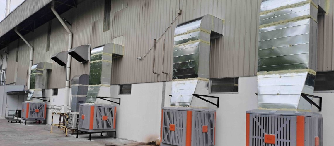 Four CrystalAir AC-500 evaporative air coolers installed outside an instant noodle factory production floor in Malaysia.