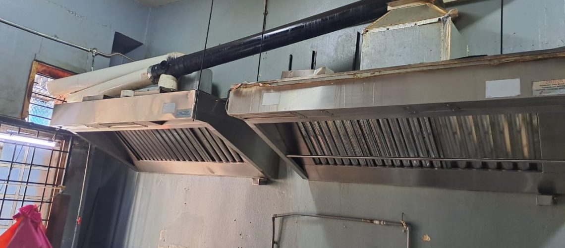 Existing restaurant kitchen exhaust hood installation with no fan motor and improper PVC pipe ducting